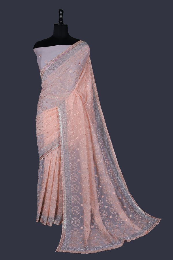 Peach saree in Cristal with Ton-to-Ton thread work with Heavy Jarkan Border.