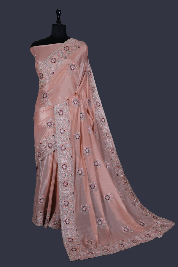 Peach saree in Fancy Fabric with Embroidery work with Jarkan Work.